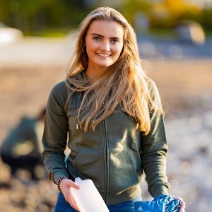 smiling-female-volunteer-holding-bottle-and-garbag-2021-08-28-13-43-36-utc-qcnh2jringto5cgmmjy84xz1dhdhssut8znu51serc
